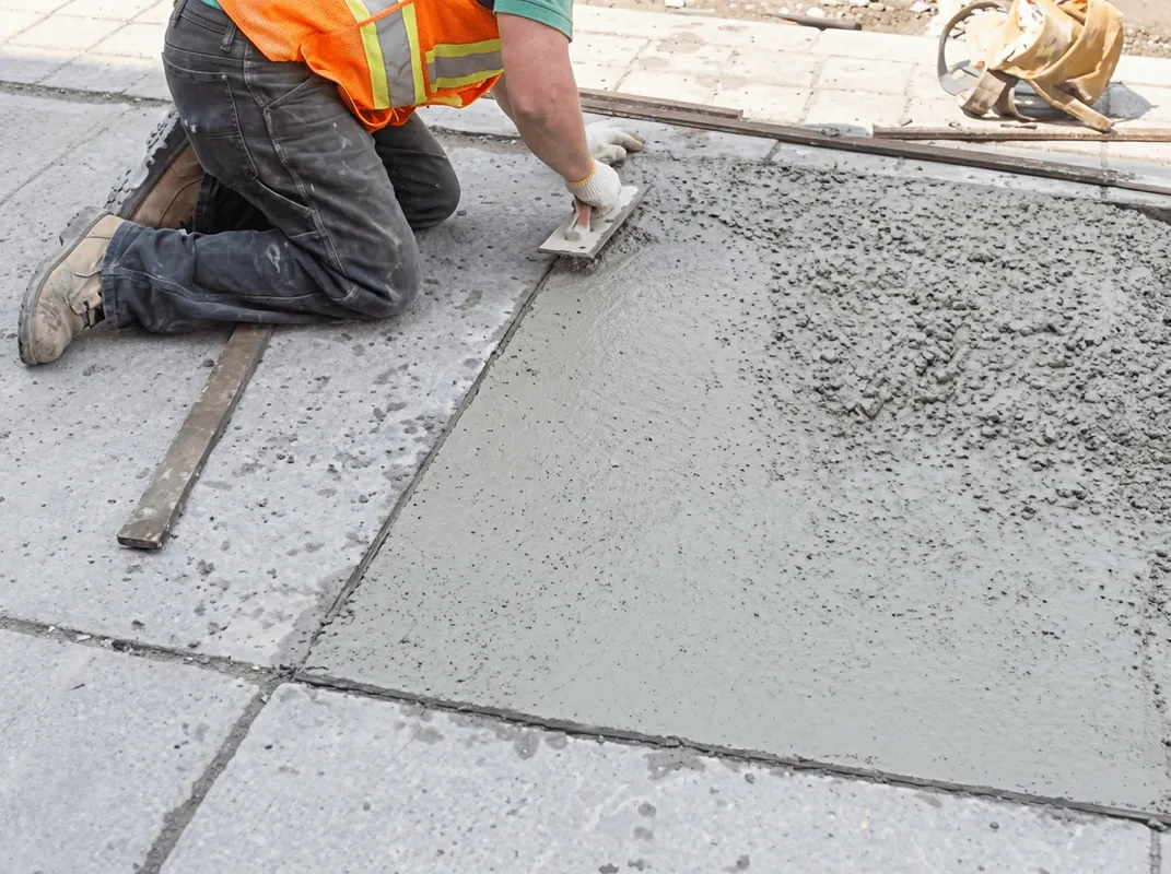 Professional repairing a concrete floor in Toledo, OH